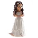 Figura de bolo menina morena com jaqueta rosa e tênis esportivos