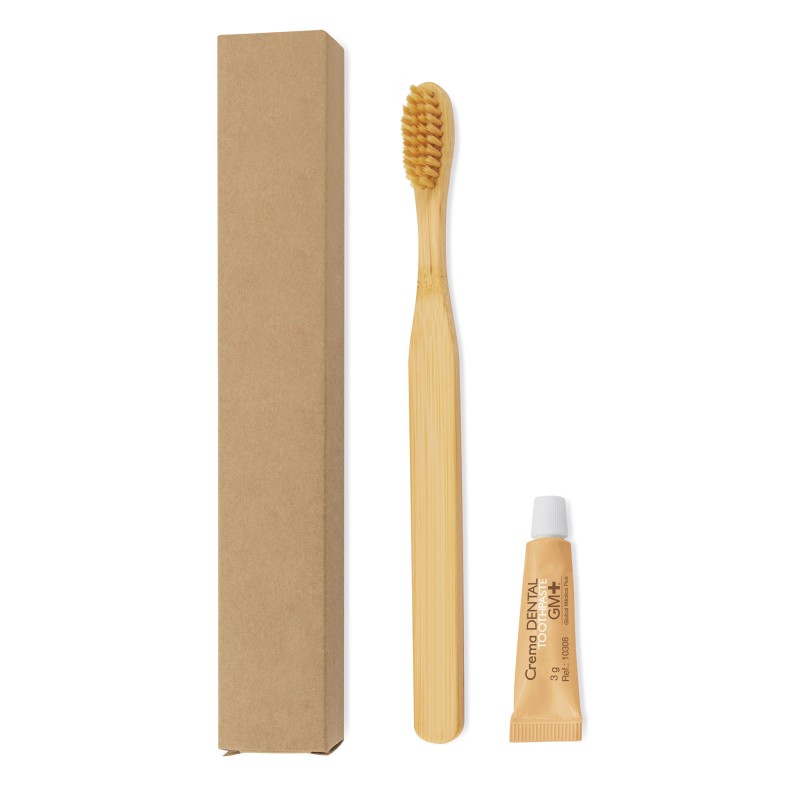 Escova de dentes e creme dental de bambu apresentados com caixa