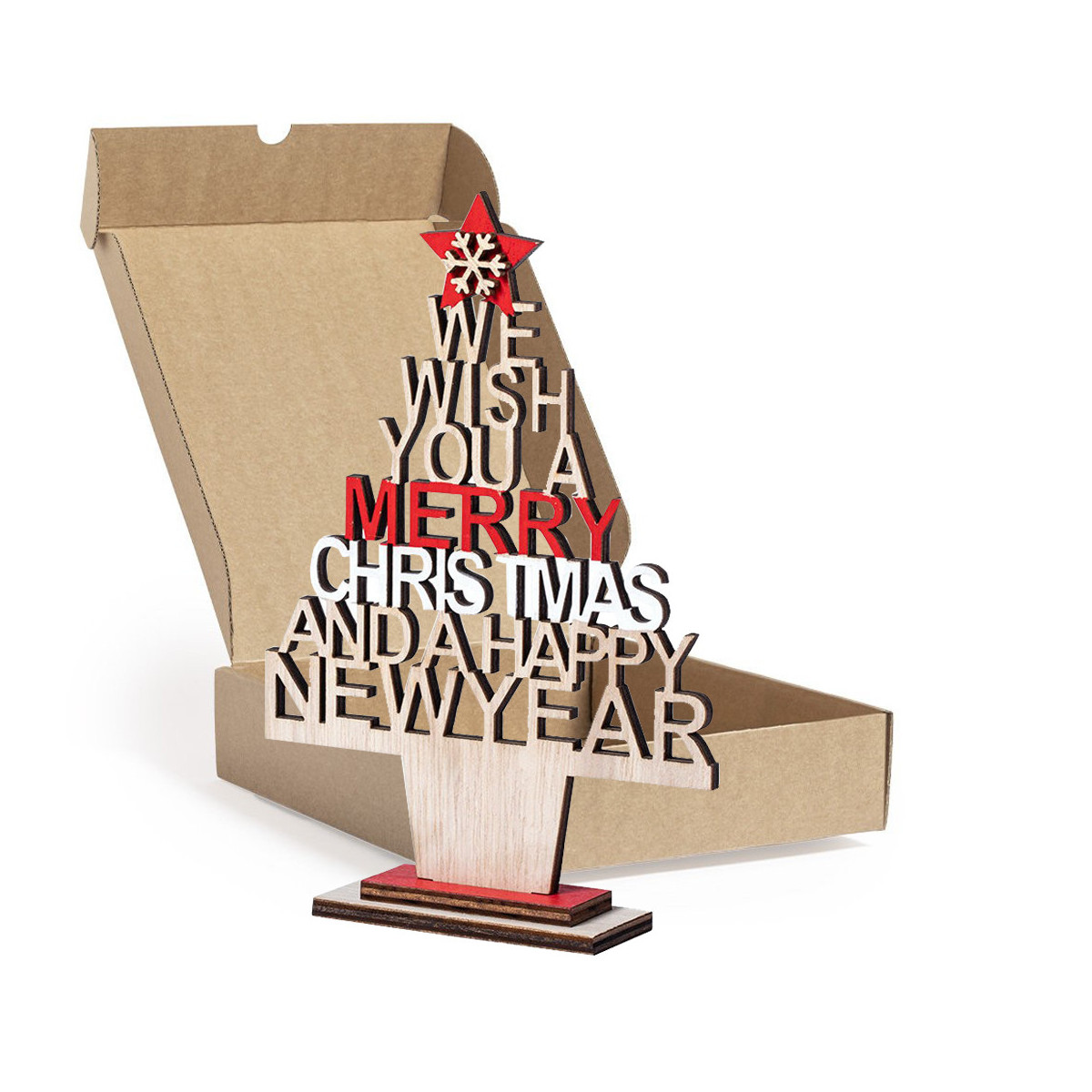 Pequena árvore de natal sobre a mesa apresentada em caixa quadrada de papelão