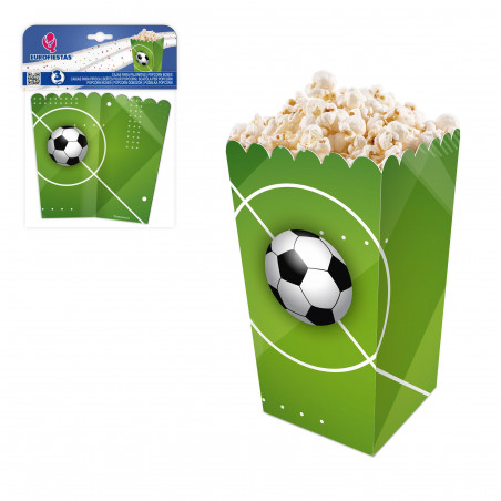 Caixa de pipoca com bola de futebol na grama