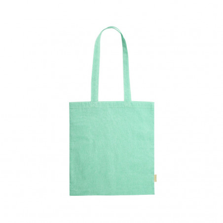 Presente de dinossauros apresentado em uma bolsa de pano com um adesivo personalizável em uma etiqueta de madeira