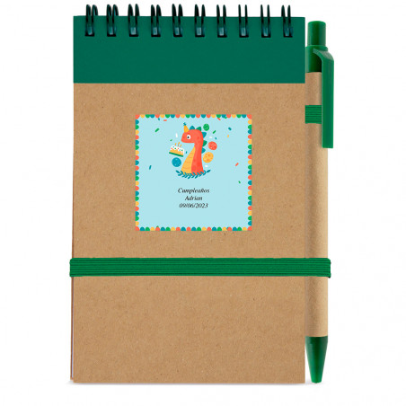 Caderno com caneta e adesivo de design de dinossauro para detalhes