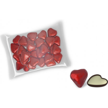 Pomperos e bombons de chocolate em forma de coração em bolsa transparente com cartão de lembrança de casamento
