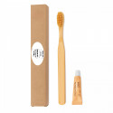 Escova de dentes de bambu e pasta de dente em caixa com adesivo para detalhes de eventos e festas